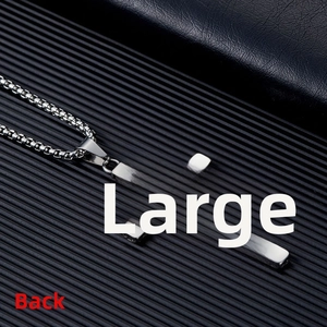 Detailed back view of a silver stainless steel cross pendant featuring hollowed side textures