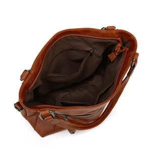 Internal structure of brown faux leather tote bag showing compartments and inner pockets