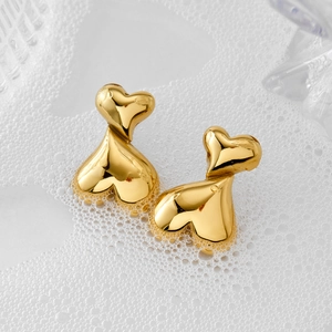 Polished gold stainless steel layered heart stud earrings with a glossy mirror finish