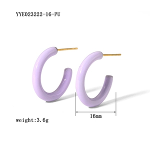 Detail view of purple enamel C-shaped earrings with 16mm diameter and gold post