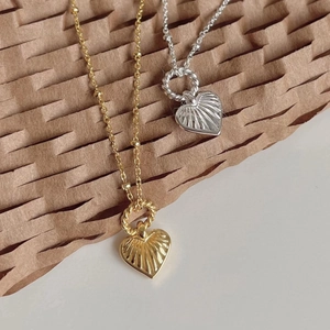 Golden and silver 925 sterling silver necklaces with sunburst heart pendants and beaded chains