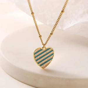Vintage 18K gold plated copper necklace with a blue enamel and zircon heart pendant