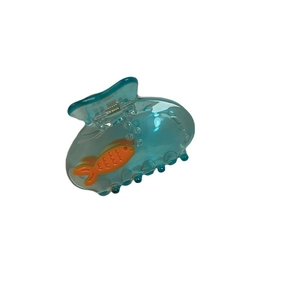 Blue translucent hair claw clip with orange fish relief and aquatic bubble design