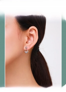 Close-up of S925 sterling silver geometric round earrings with sparkling zircon stones