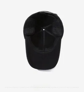 Detail view of the thickened plush lining and foldable earflaps on winter baseball cap