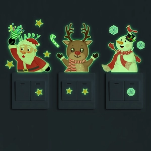 Luminous Christmas switch stickers featuring Santa Claus, reindeer, and stars glowing in dark