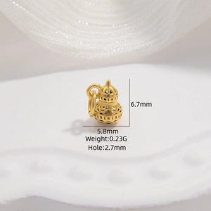 Close-up of golden hollow gourd spacer bead with size and weight dimensions shown