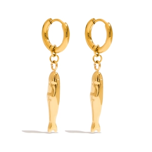 Detailed view of polished gold fish dangle earrings with a minimalist round hoop buckle