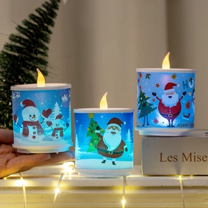 Three-piece LED Christmas candle set with Santa and snowman prints for festive home decor