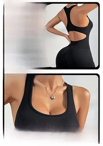 Close-up of seamless ribbed fabric and open back cutout on a black yoga bodysuit