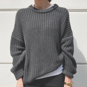 Oversized grey cable knit sweater for women with round neck in minimalist style
