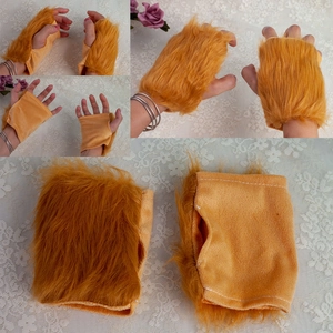 Detail of plush orange fingerless lion gloves showing soft texture and dual-sided material