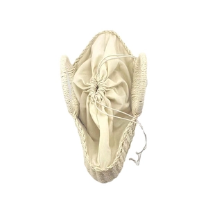 Half-moon woven straw handbag with drawstring lining for beach vacation and summer style