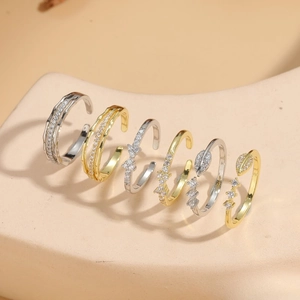 Minimalist geometric bow open rings with zircon stones in silver and gold finishes