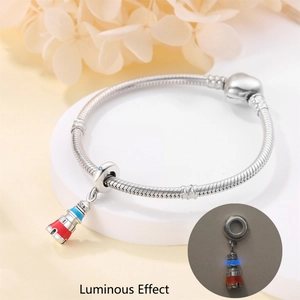 Luminous lighthouse charm bead on silver snake chain with red and blue enamel detail