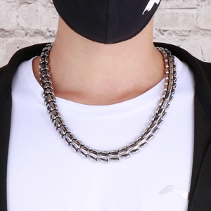 Men's punk style silver titanium steel dragon bone chain necklace on male model