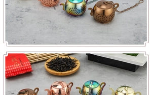 Macro detail of teapot shaped tea infusers in various metallic finishes with hanging chains