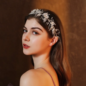 Detail of silver floral bridal headband with crystals on model for wedding hair