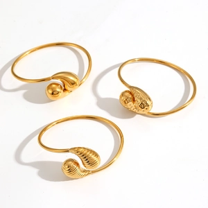 Three-piece set of golden stainless steel open bangles with smooth and textured finishes