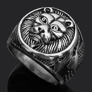 Detailed close-up of a silver lion head relief on a men's vintage stainless steel ring