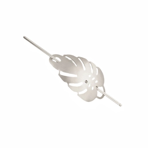 Detailed close-up of a silver monstera leaf hair stick with brushed metal texture finishes