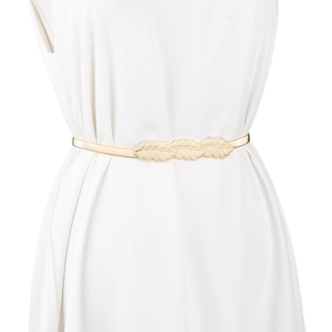 Detailed view of golden leaf decorative buckle on an elastic spring metal waist belt