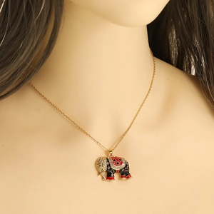 Golden delicate necklace featuring a colorful elephant pendant with enamel and rhinestones