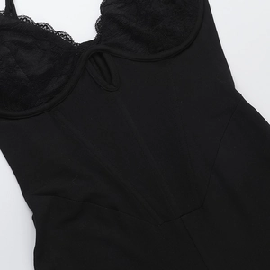 Detailed view of black lace stitching and structured boning on a sexy slim bodysuit