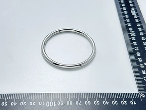 Detailed measurement of high-polished stainless steel bangle showing 70mm outer diameter