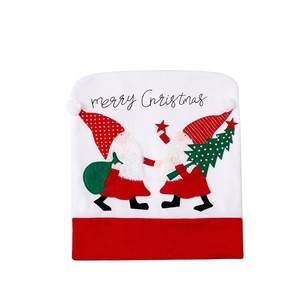 Christmas chair back cover featuring red and white gnome embroidery with Merry Christmas text