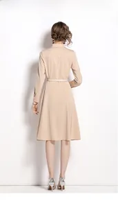 Elegant apricot long-sleeve shirt dress with waist belt shown from back view