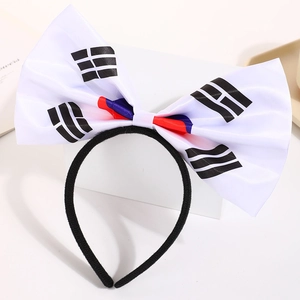 Detail of fabric bow headband with South Korean flag pattern on a slim black band
