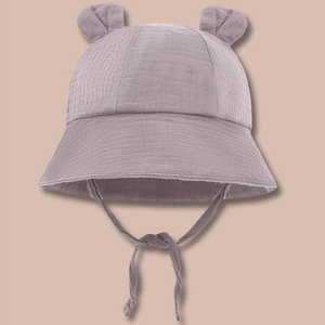 Lavender cotton baby sun hat with cute animal ears and chin strap on brown background