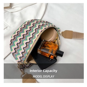 Detail view of colorful zigzag woven crossbody bag showing large internal capacity