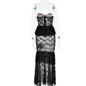 Detail showing sheer black lace texture and ruffle design of the fishtail maxi dress