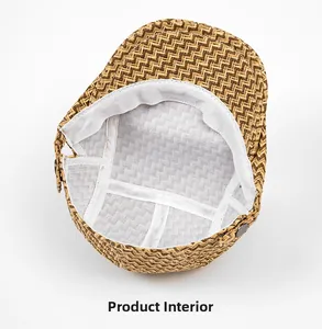 Detail view of woven straw beret hat interior lining with metal button and reinforced stitching