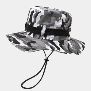 Detail of camouflage boonie hat featuring metal ventilation eyelets and adjustable chin cord