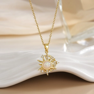 Macro view of sun and moon pendant with shimmering opal stone and micro-set cubic zirconia