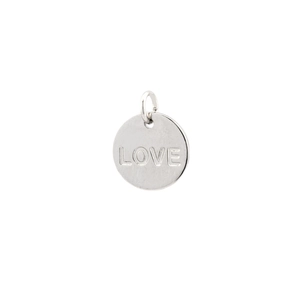 Macro shot of silver metal round pendant featuring hollow star and LOVE engraving