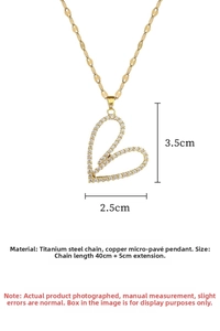 Detailed view of the luxury titanium steel gold heart pendant with cubic zirconia stones