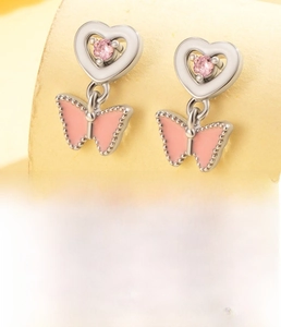 Detail of pink zircon heart and butterfly drop earrings with titanium steel screw back