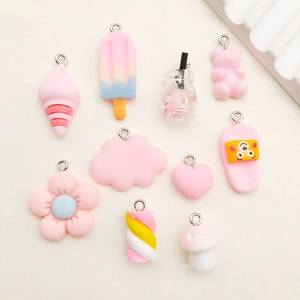 Flat lay of colorful resin charms including ice cream and clouds for DIY crafts