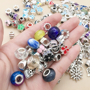 Detailed close-up of colorful DIY alloy beads and enamel charms for jewelry making