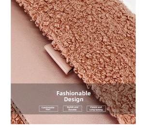 Detail of pink-brown faux leather and lamb wool patchwork with precise stitching