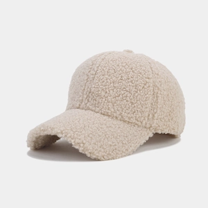 Detailed side view showing the soft lamb wool texture and curved brim of the baseball cap