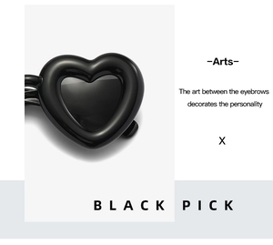 Macro shot of glossy black heart-shaped frames with sleek metal temple details
