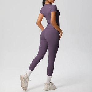 Detail of purple seamless high-stretch yoga set with cropped tee and high-waist leggings