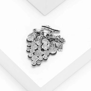Silver grape brooch with abalone shell inlays shown from back with pin fastener