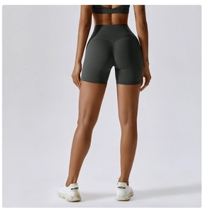 Rear view detail of dark grey high-waisted yoga shorts with peach hip lifting seam