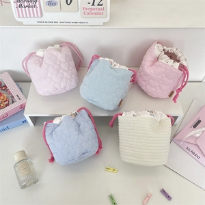 Five styles of mini drawstring quilted storage bags for cosmetics and jewelry organization
